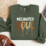 a green sweatshirt with the words melanited soul on it