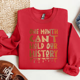 a red sweatshirt with the words one month can't hold our history printed on