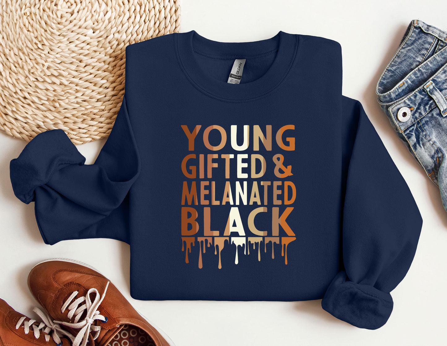a blue sweatshirt with the words young, gifted and melaned black on