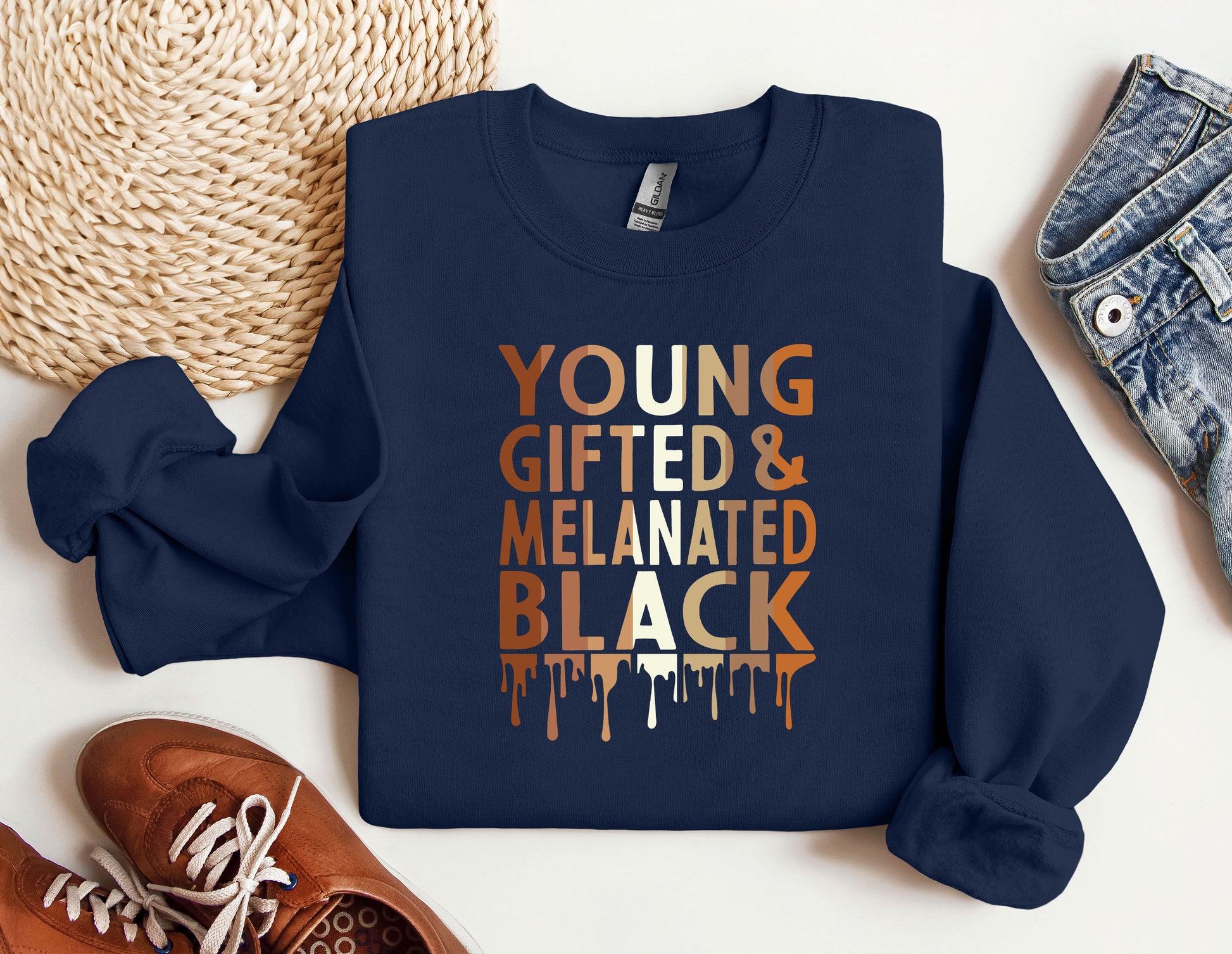 a blue sweatshirt with the words young, gifted and melaned black on
