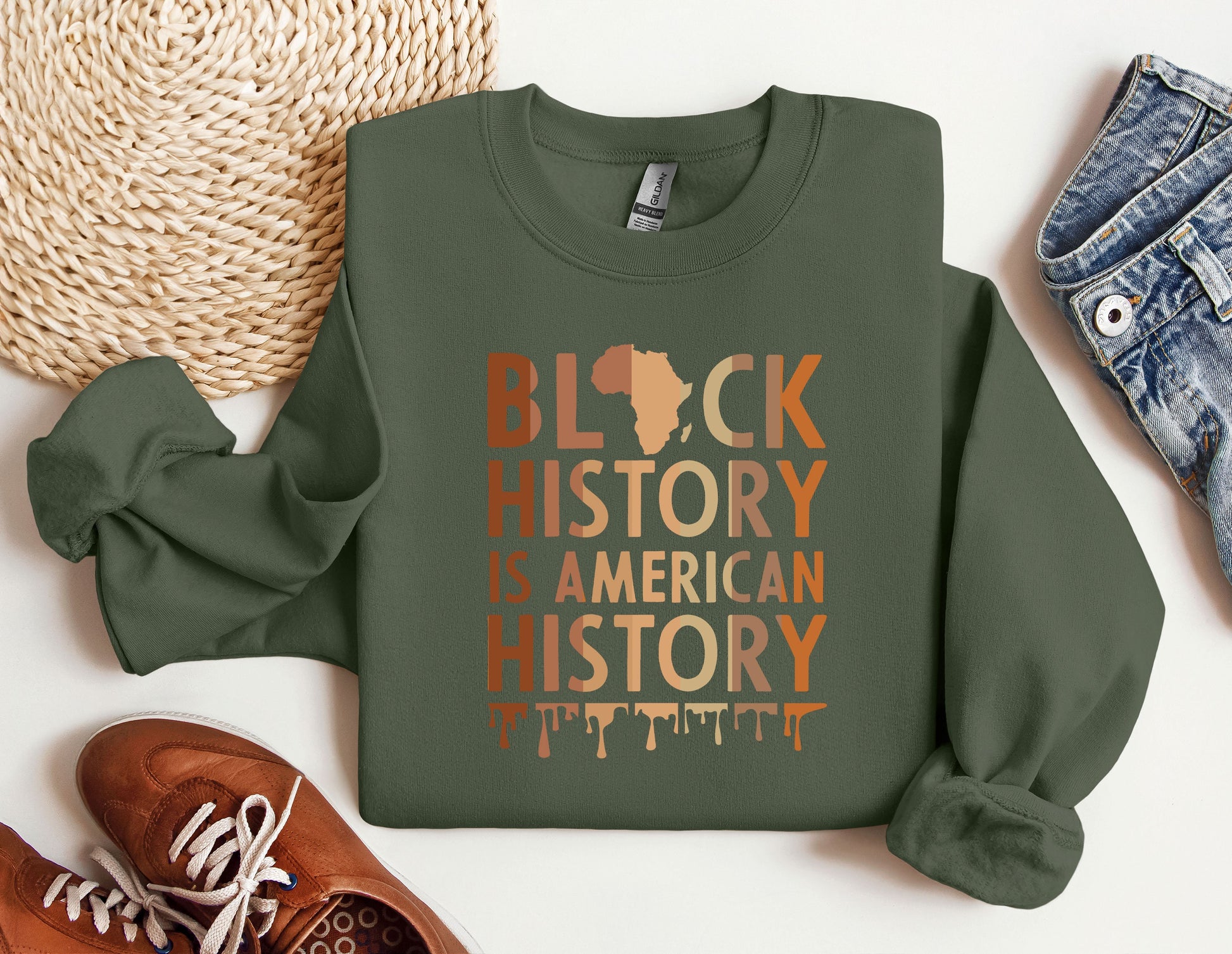 a green sweatshirt with the words black history is american history printed on it