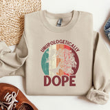 a sweater with a picture of a woman on it next to a pair of shoes