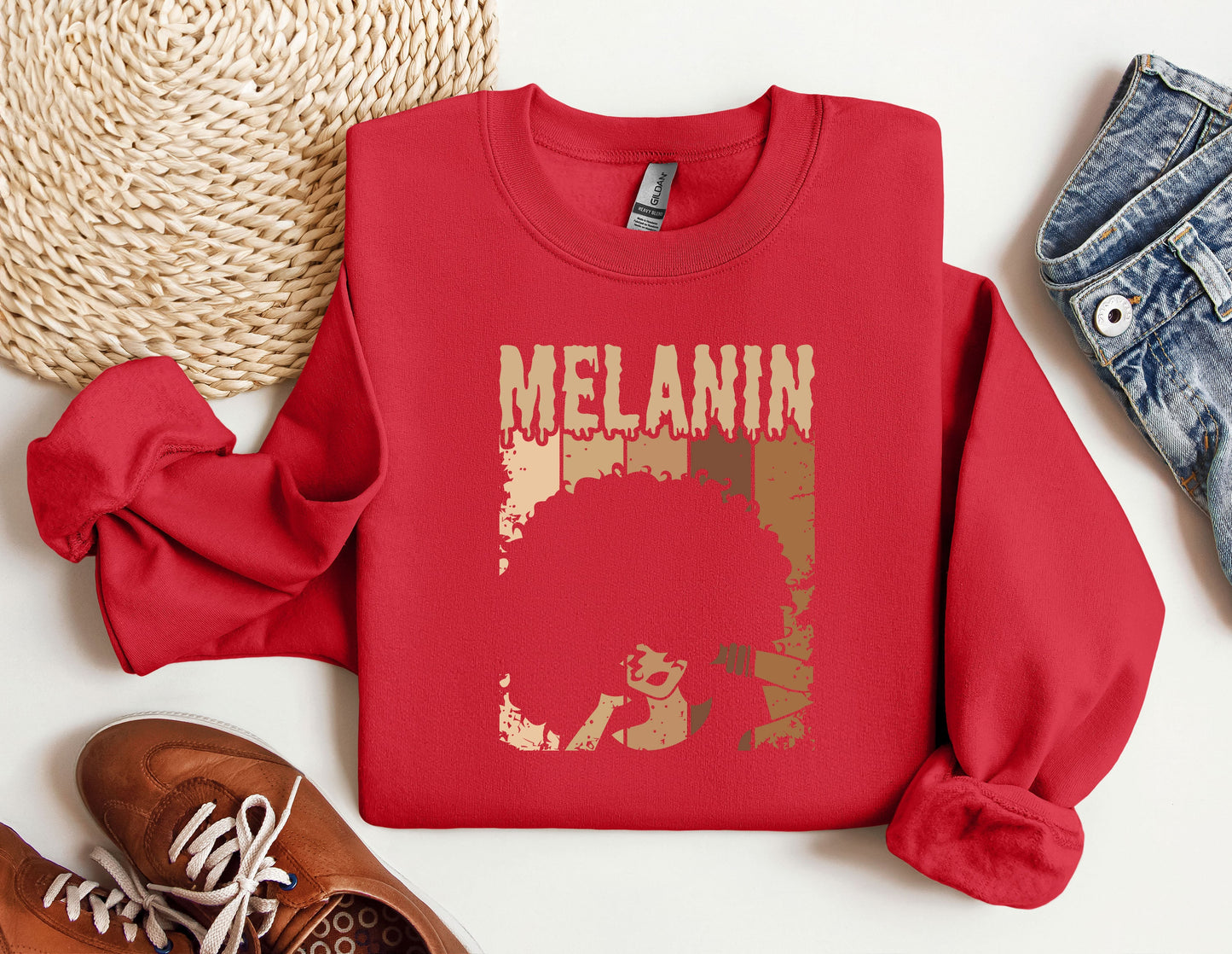 a red sweatshirt with the word melanin on it