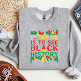 a sweatshirt that says to see me is to see black history