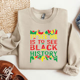 a sweater that says to see me is to see black history
