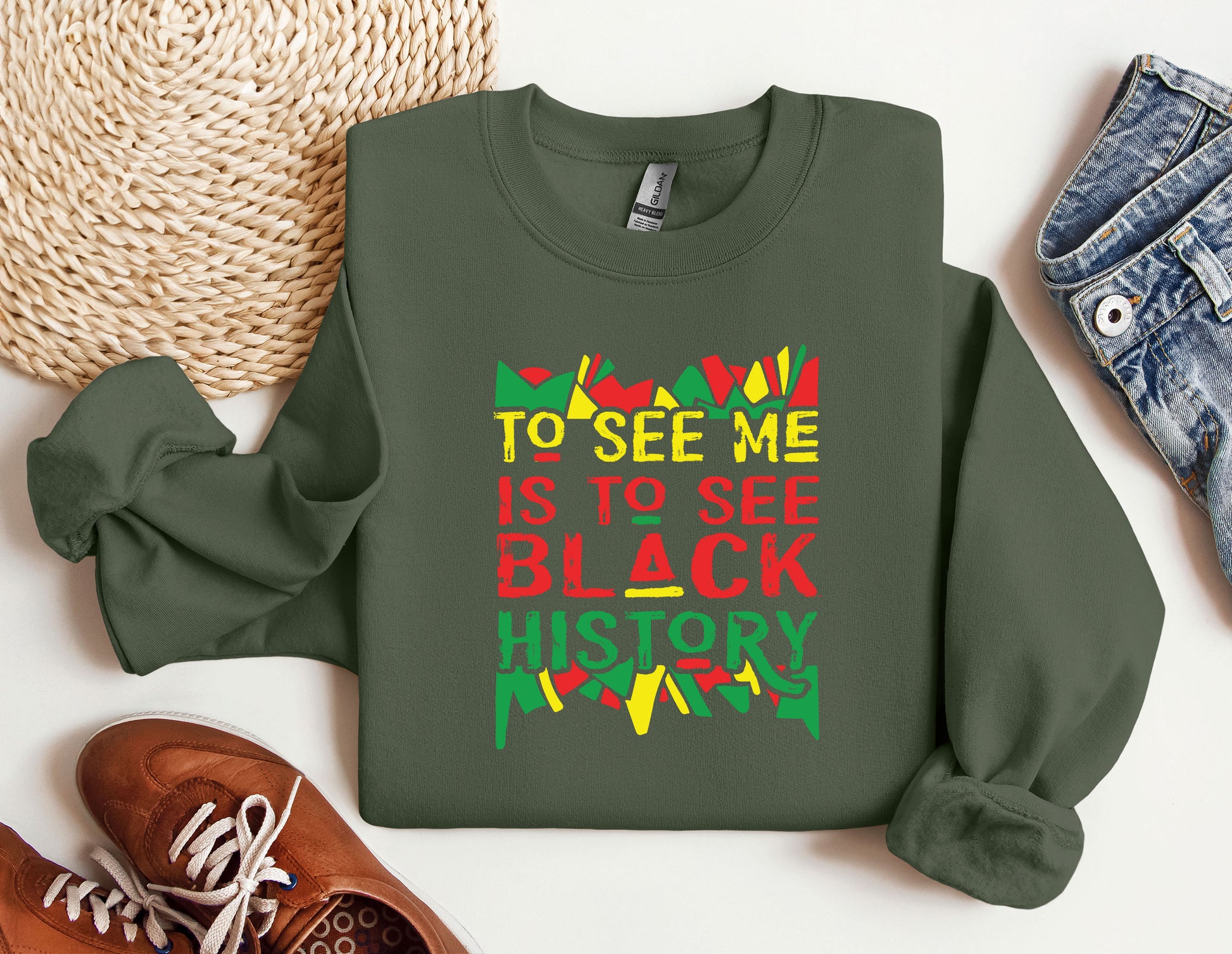 a green sweatshirt with the words to see me is to see black history