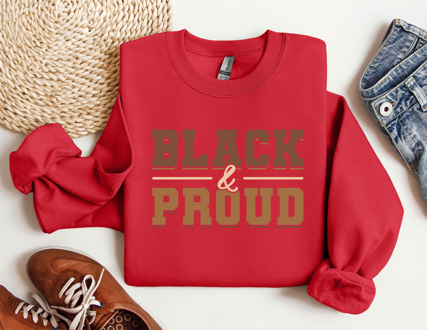 a red sweatshirt with the words black and proud on it