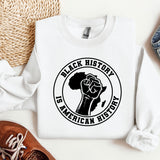 a white sweatshirt with a black history month logo on it