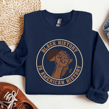 a blue sweatshirt with a brown fist on it