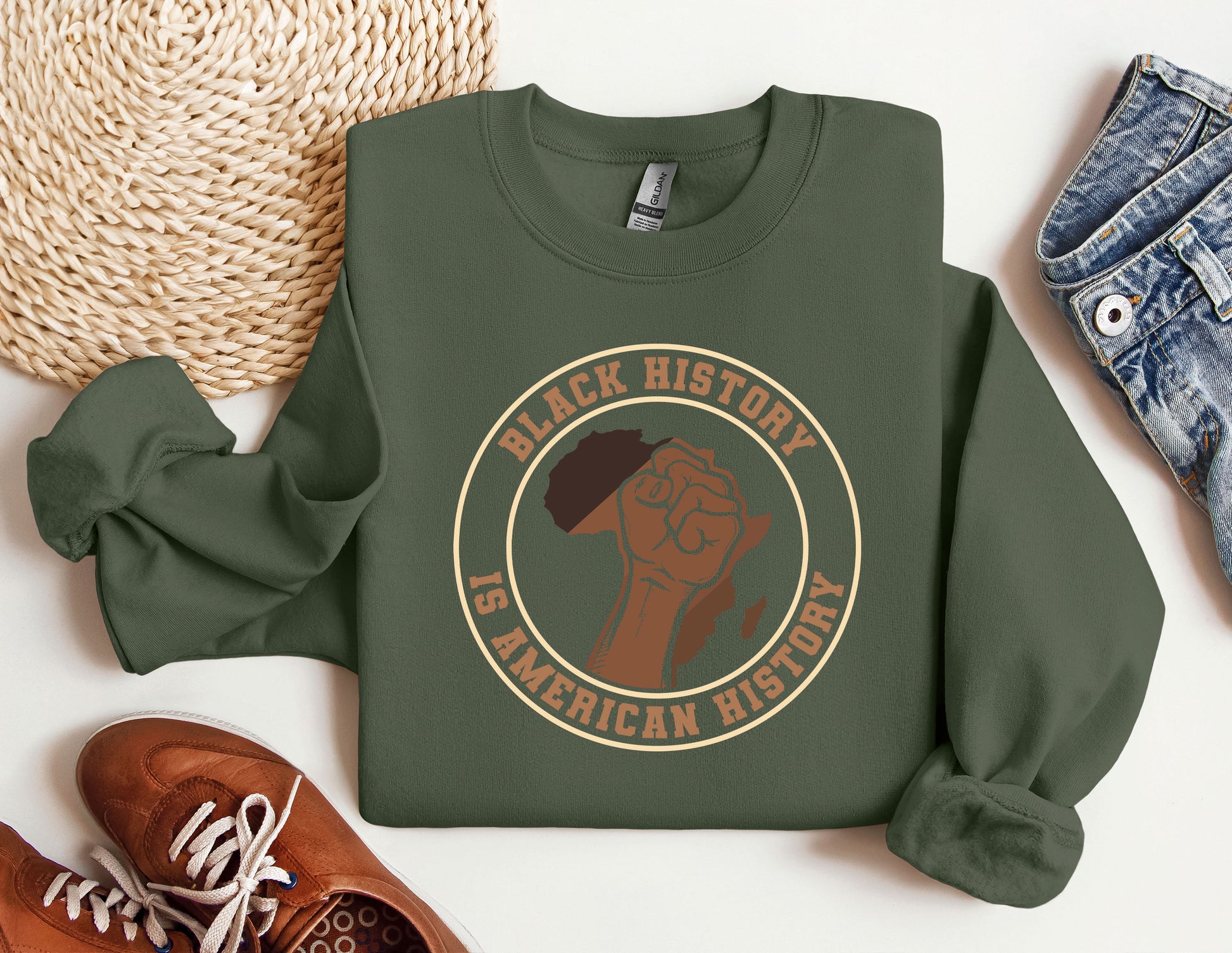 a green sweatshirt with a black history graphic on it