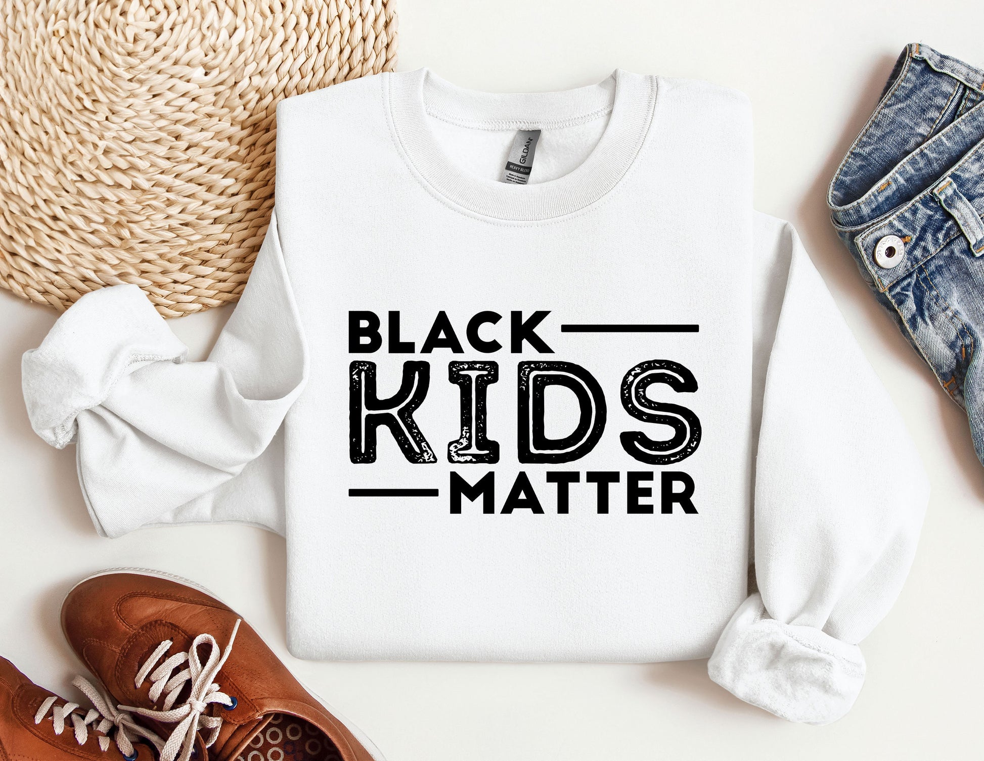 a white shirt that says black kids matter