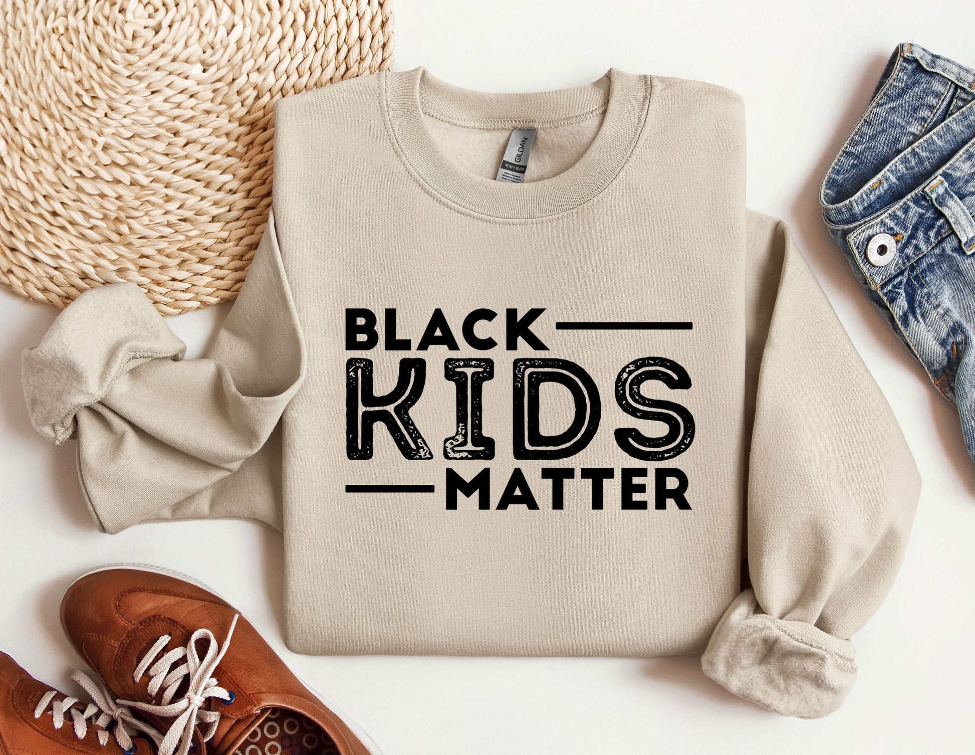 a sweater with the words black kids matter on it