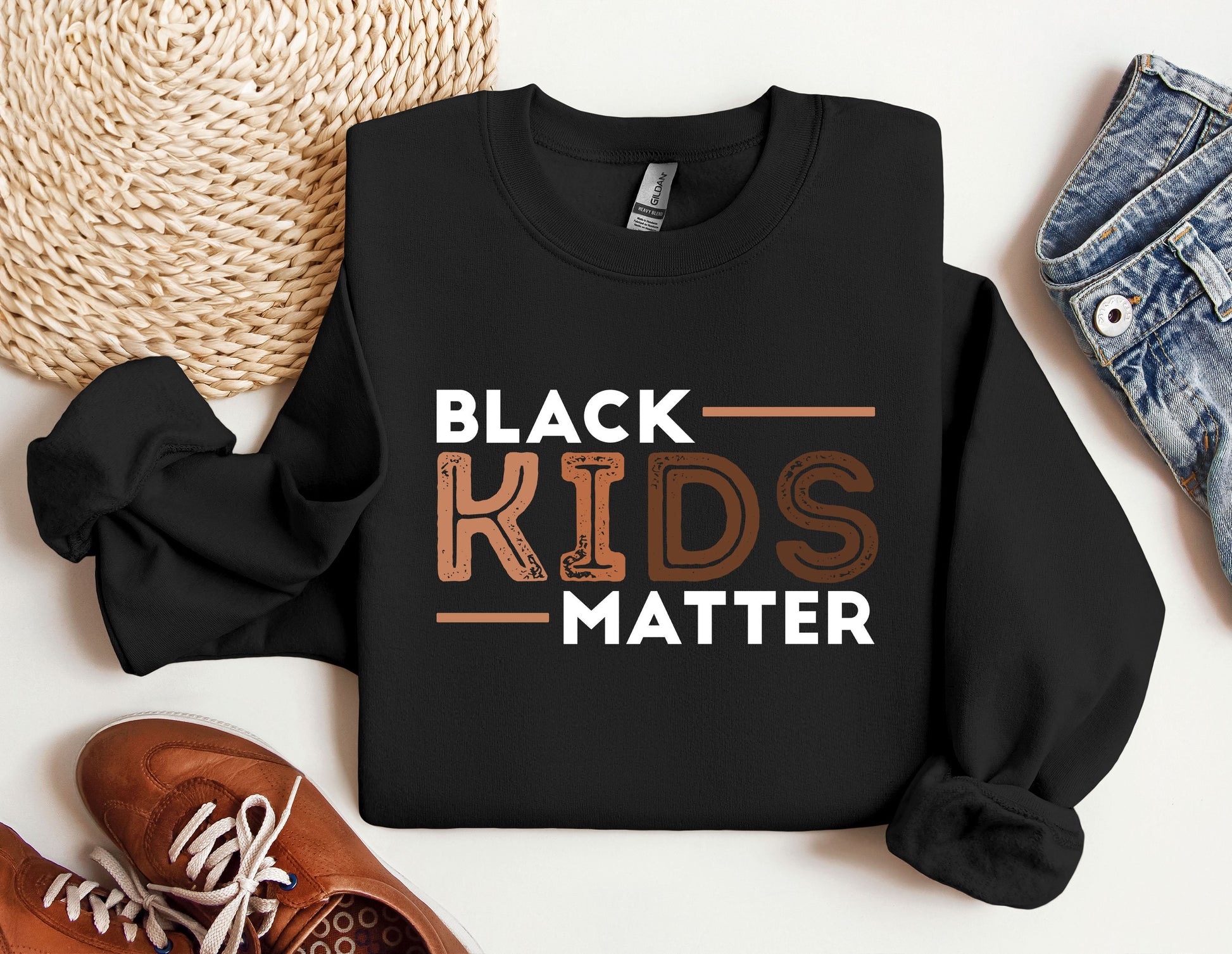 a black shirt that says black kids matter