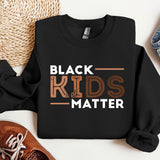 a black shirt that says black kids matter