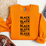 an orange shirt with black lettering on it
