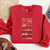 a red sweatshirt with a black love story written on it