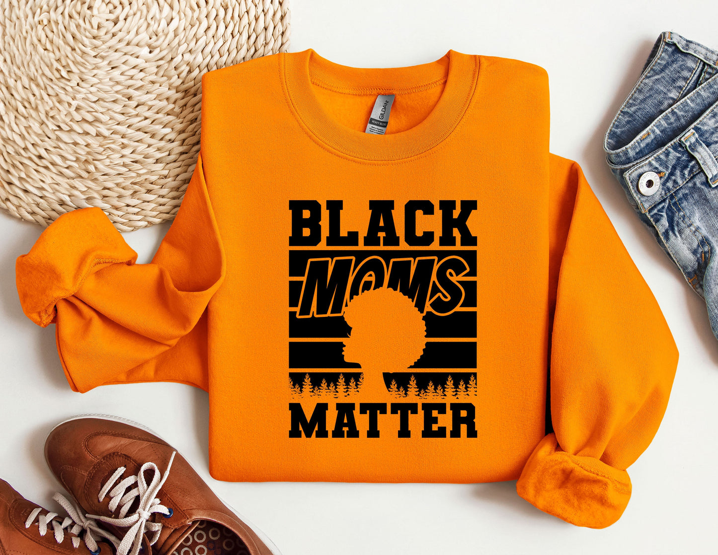 an orange shirt that says black moms matter