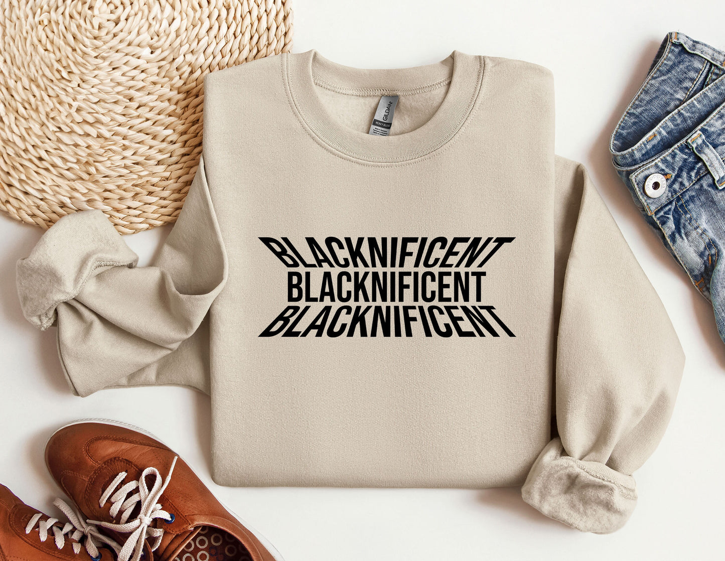 a sweater with the words blackinficent on it next to a pair of