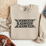 a sweater with the words blackinficent on it next to a pair of