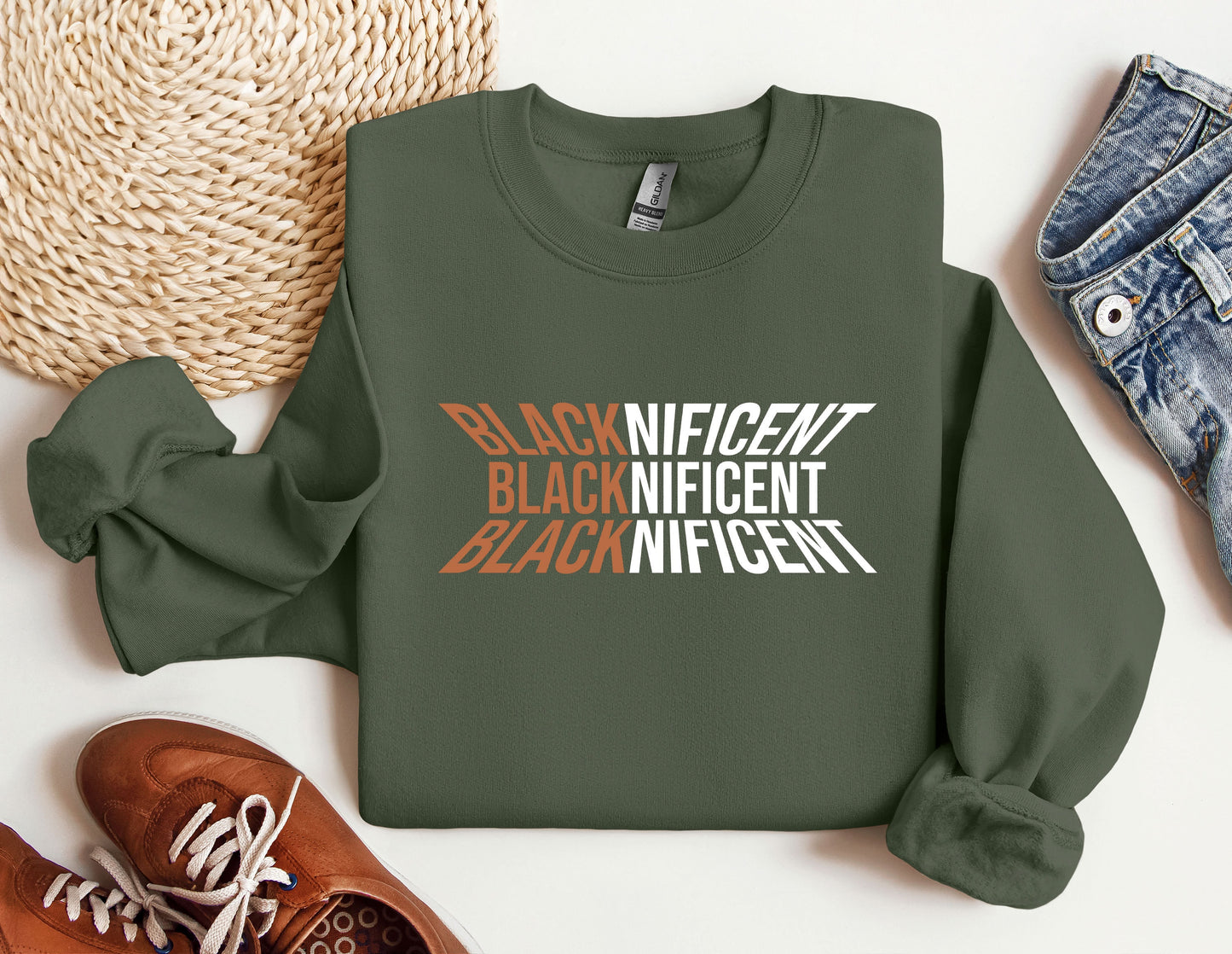 a green sweatshirt with the words black and white on it next to a pair of