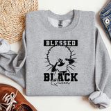 a grey sweatshirt with a black cat on it