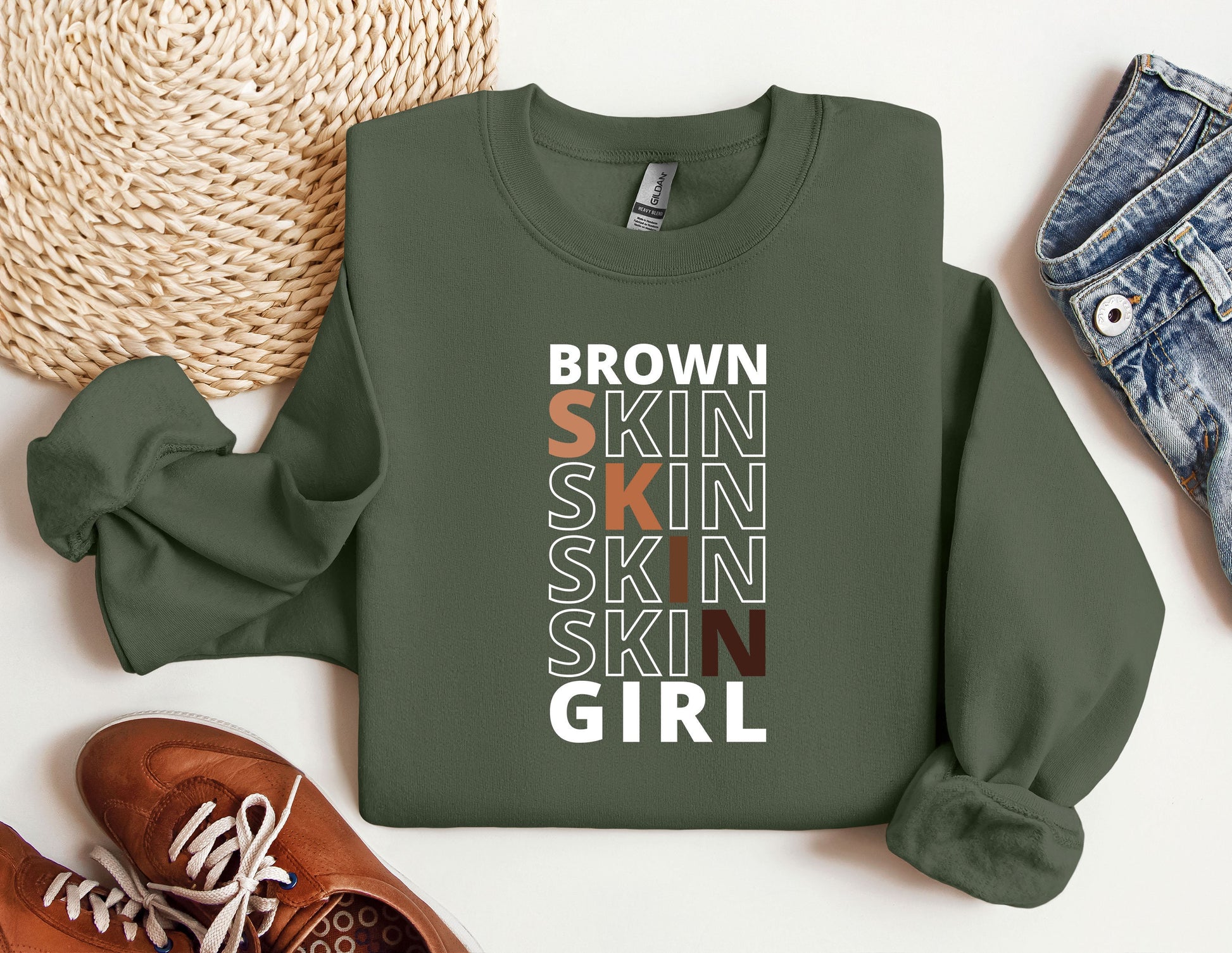 a green sweatshirt with the words brown skin, skin, skin, skin, skin