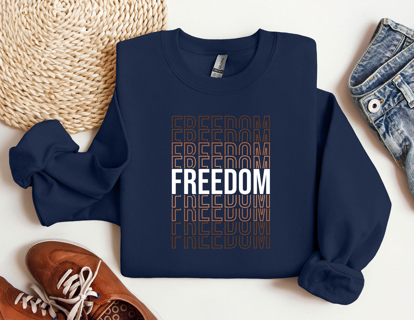 a blue sweatshirt with the words freedom and a pair of sneakers