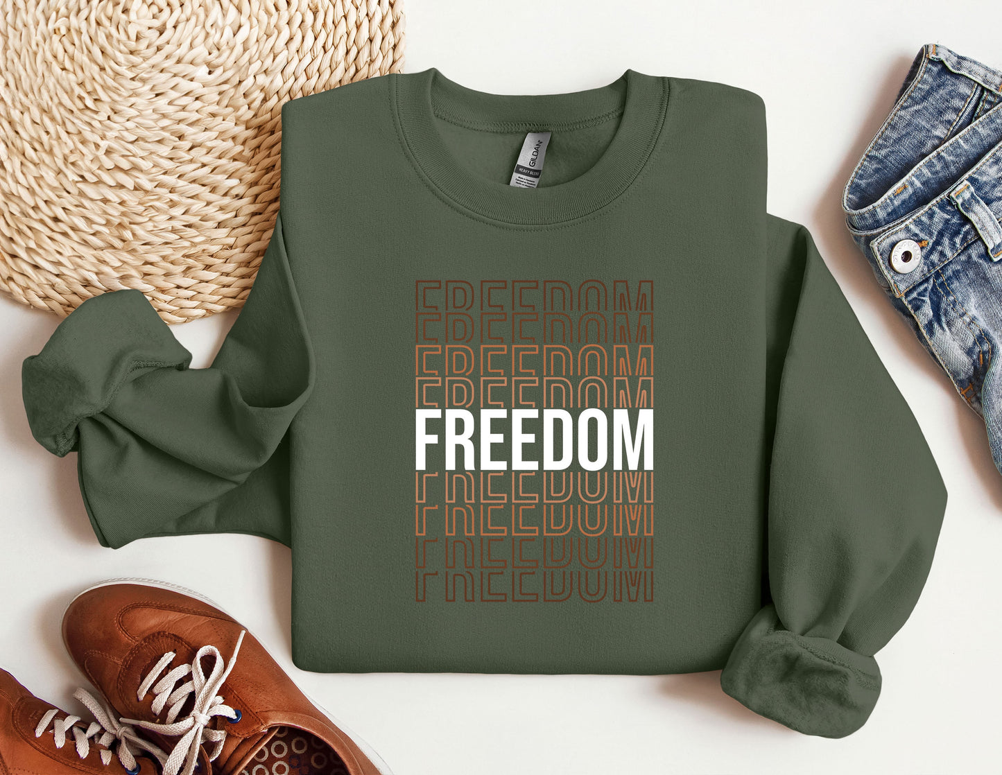 a green sweatshirt with the words freedom and a pair of sneakers