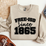 a sweater that says free - isd since 1965 next to a pair of shoes