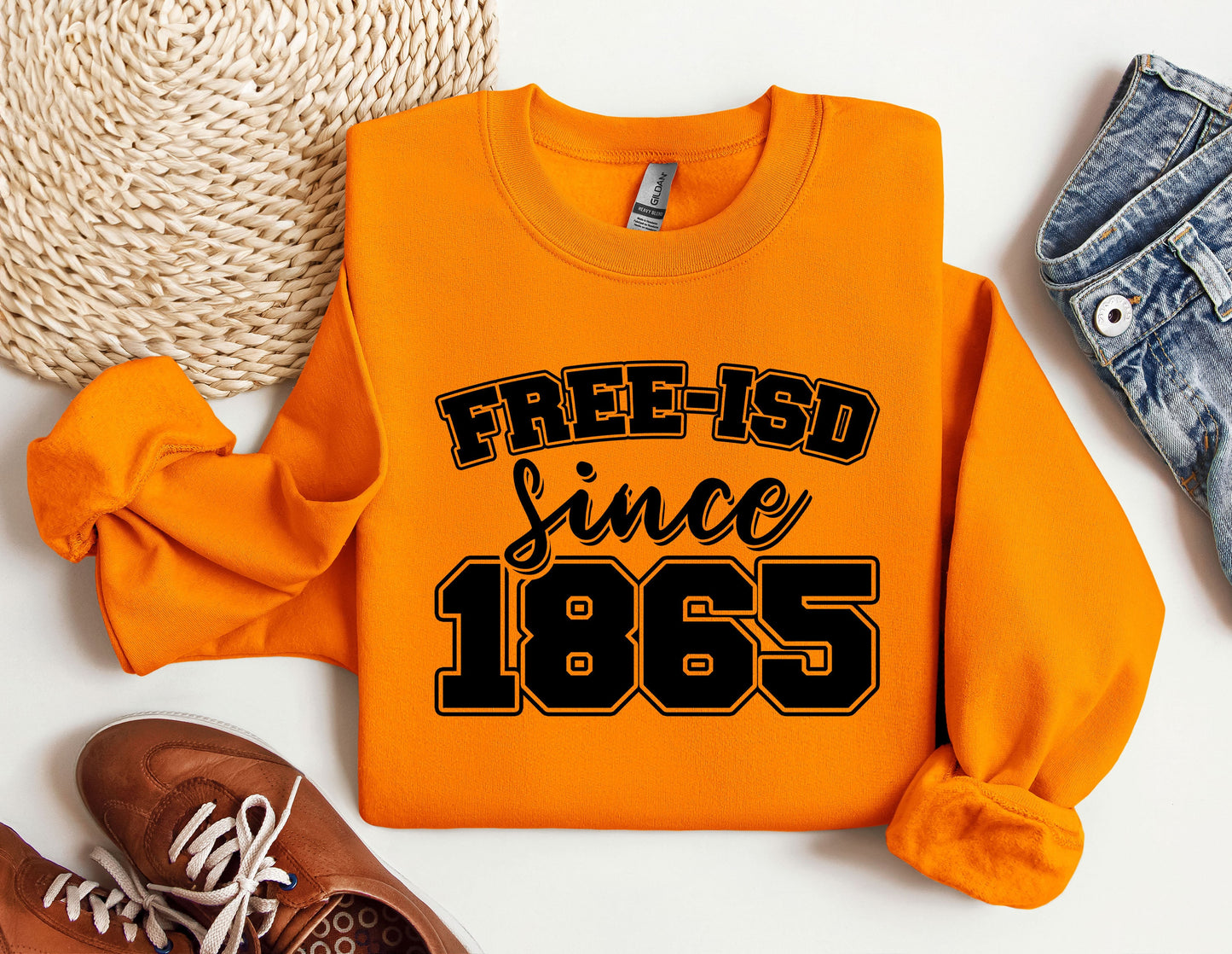 a pair of shoes and a sweatshirt with the words free - isd since 1965