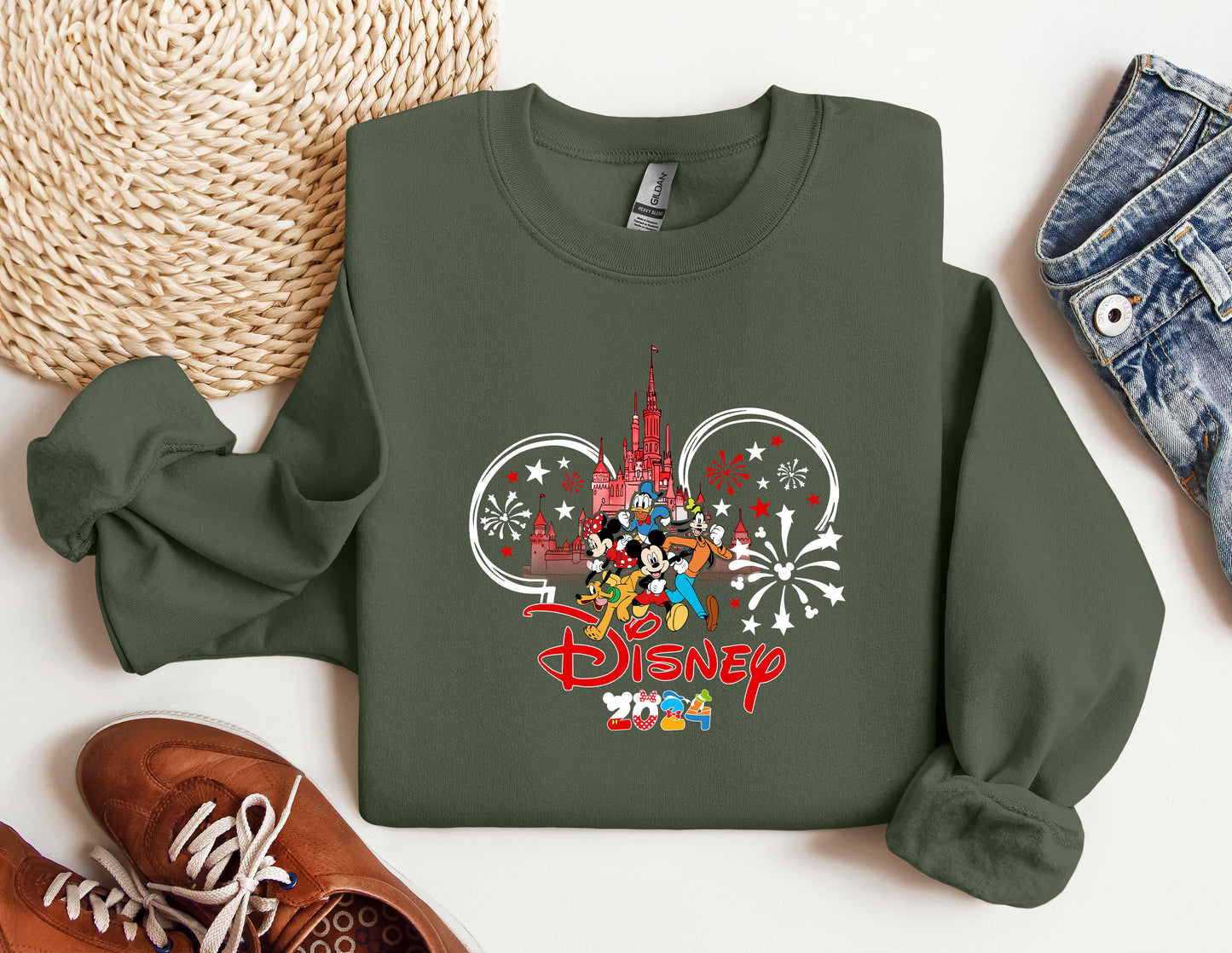 a green sweatshirt with mickey mouse on it