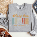 a sweatshirt with a bar code on it next to a pair of shoes
