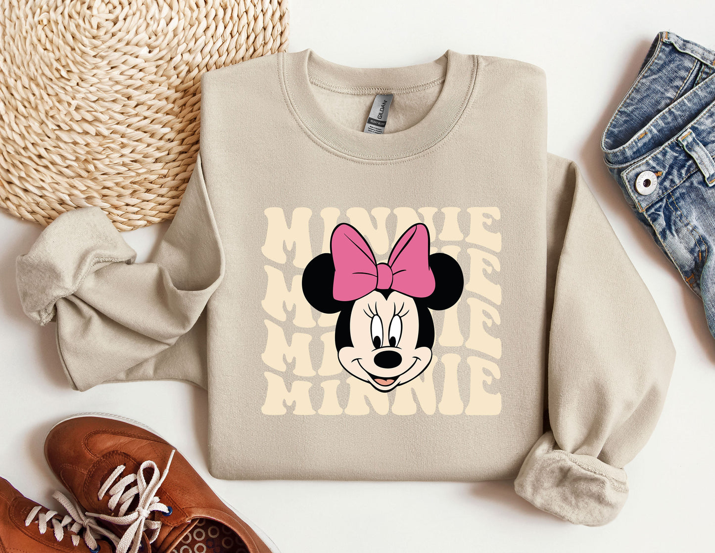 a sweater with a minnie mouse face on it