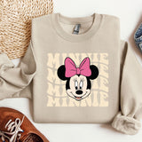 a sweater with a minnie mouse face on it