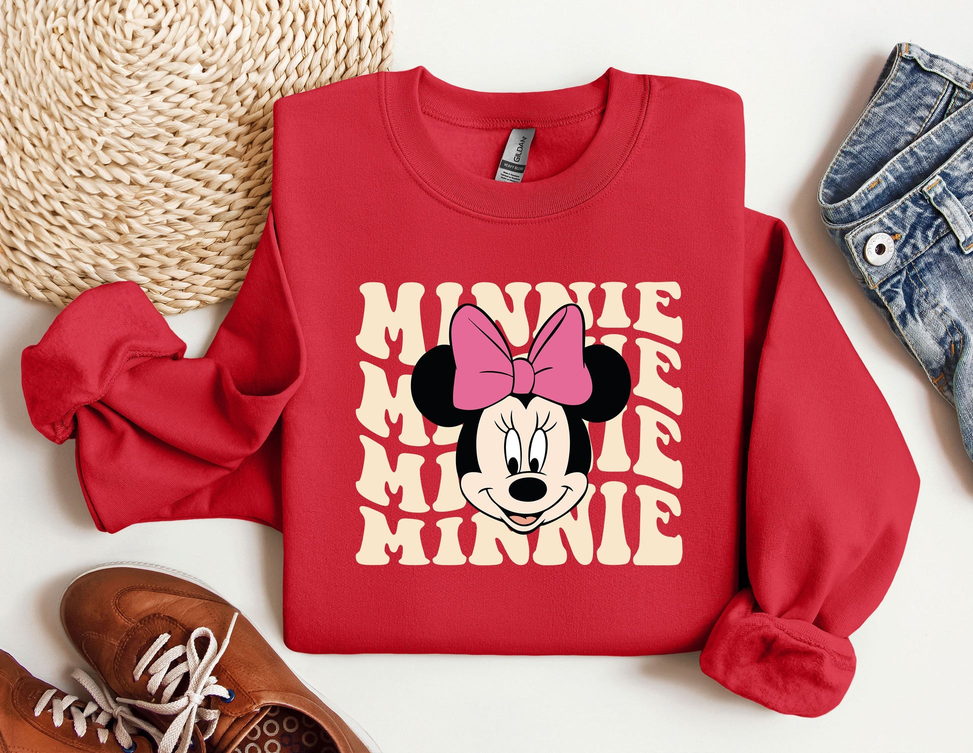 a red sweatshirt with minnie mouse on it