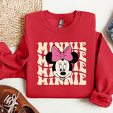 a red sweatshirt with minnie mouse on it