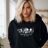 a woman wearing a mickey and co hoodie