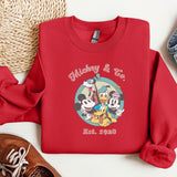 a red mickey and mickey mouse shirt next to a pair of shoes