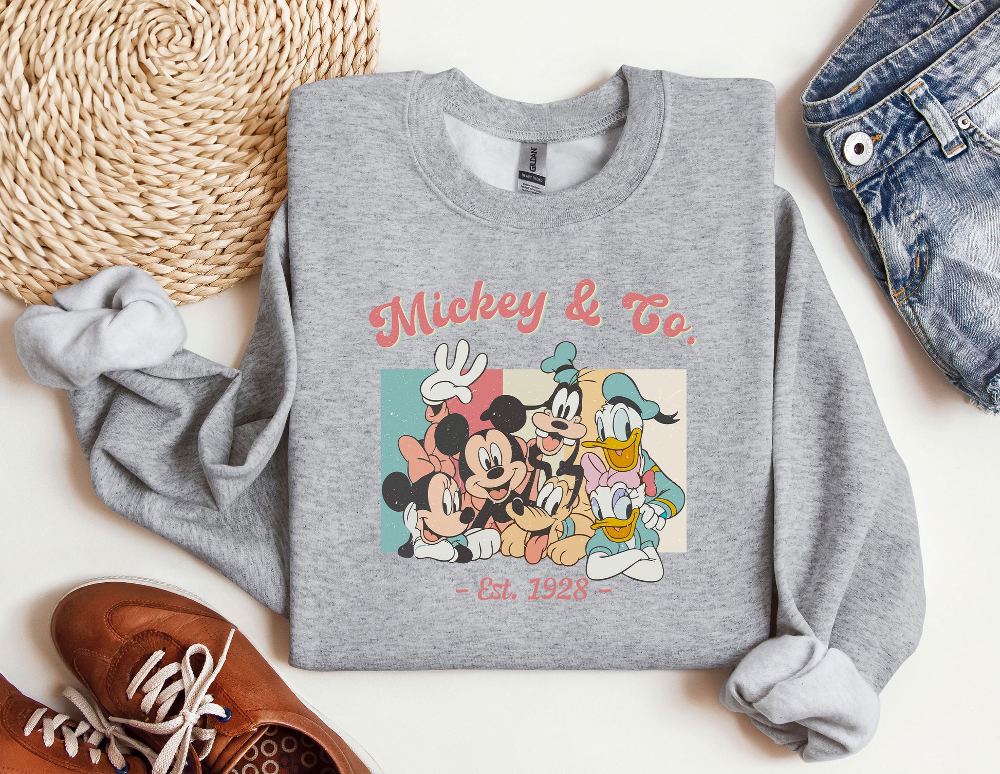 a sweatshirt with mickey and friends on it