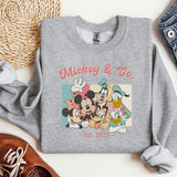 a sweatshirt with mickey and friends on it