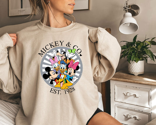 a woman wearing a mickey and minnie mouse sweatshirt