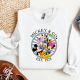 a mickey and mickey mouse shirt next to a pair of shoes