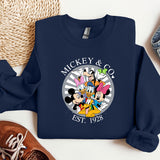 a mickey and mickey mouse shirt next to a pair of sneakers