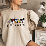 a woman wearing a sweatshirt with mickey mouse friends on it