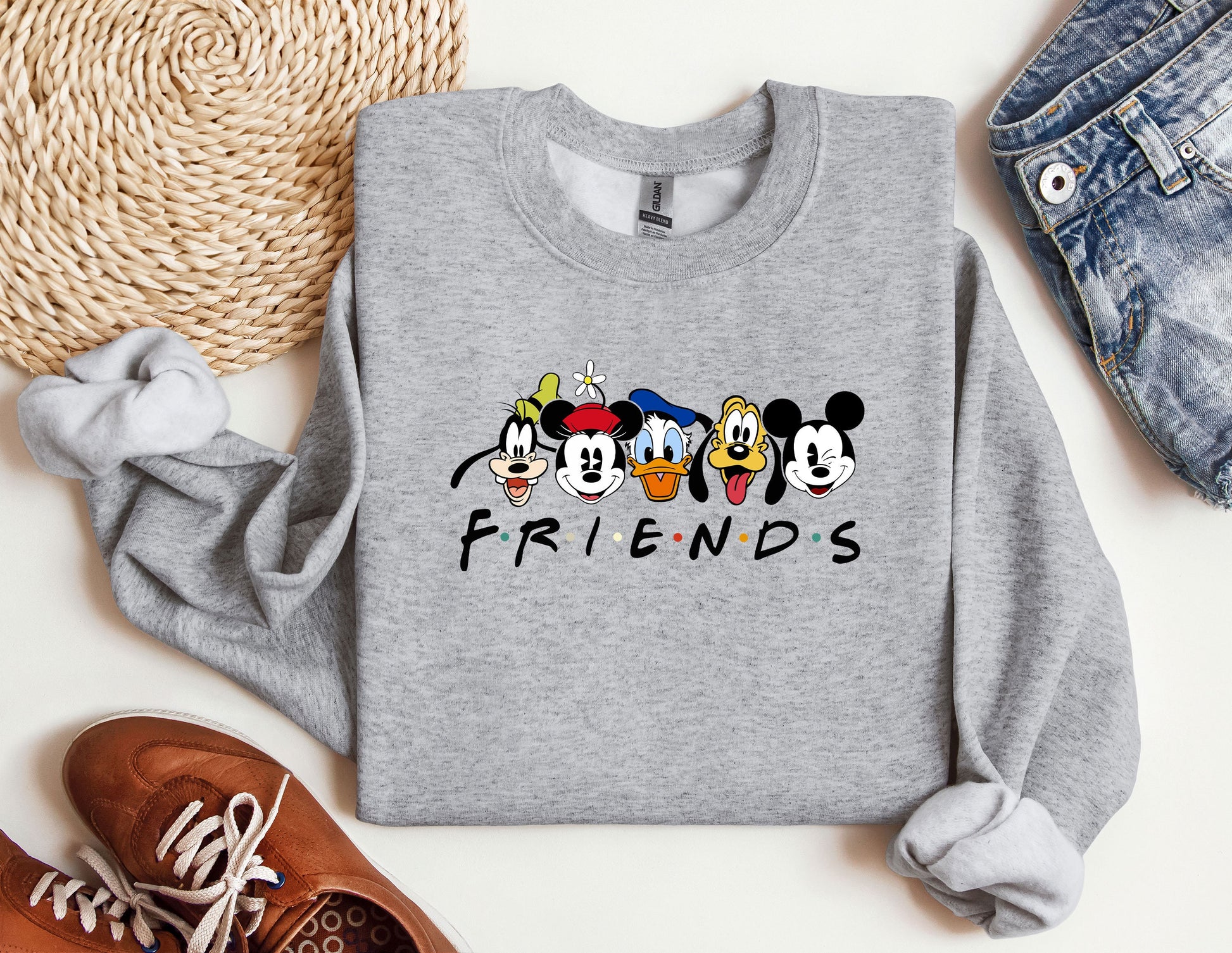 a sweater with mickey mouse and friends on it