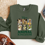 a green sweatshirt with a picture of mickey mouse and other disney characters
