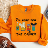 an orange shirt with a mickey mouse design on it