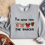 a sweater that says i'm here for the snacks