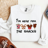 a white shirt that says i'm here for the snacks