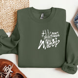 a green sweatshirt with the words don't stop and a pair of sneakers